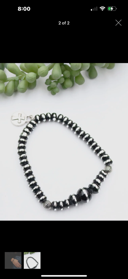 Single Strand Silver and Black Rondell
Bead Stretch Bracelet